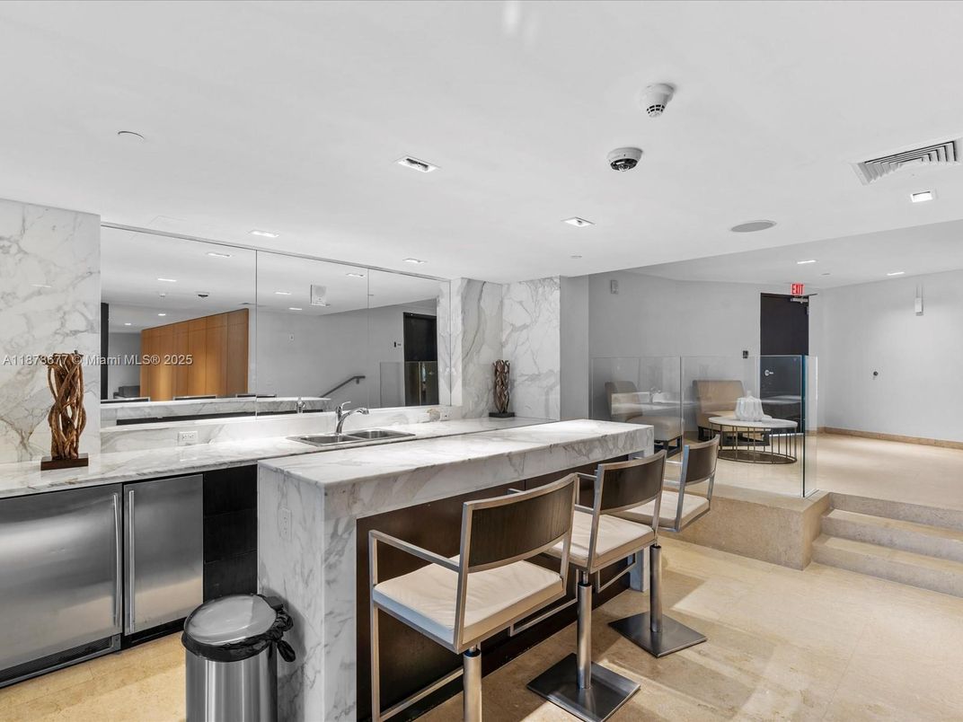 Interior, Kitchen, Marble Walls, Recessed Lighting, Stainless Steel Appliances