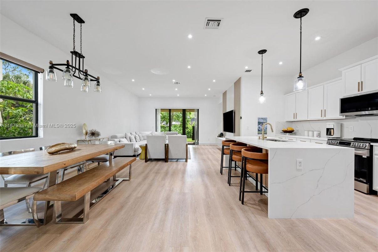 Dining room, Interior, Kitchen, Living room, Pendant Lights, Recessed Lighting, Stainless Steel Appliances, Wood Texture Flooring