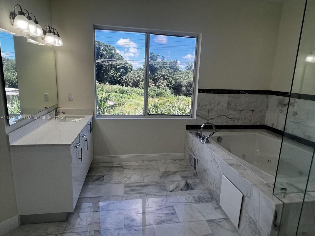 Bathroom, Dual Sink Vanities, Glass Shower, Interior, Marble, Marble Walls