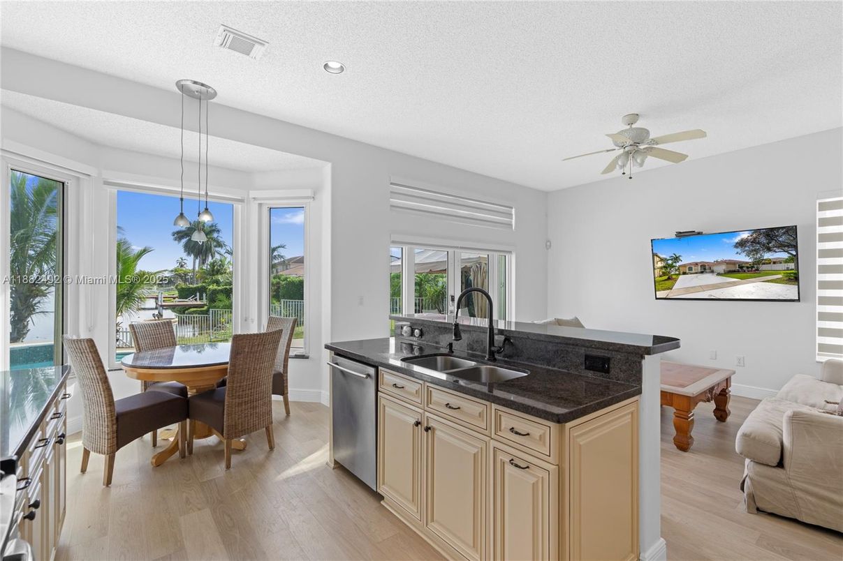 Dining room, Interior, Kitchen, Pendant Lights, Recessed Lighting, Stainless Steel Appliances, Wood Texture Flooring