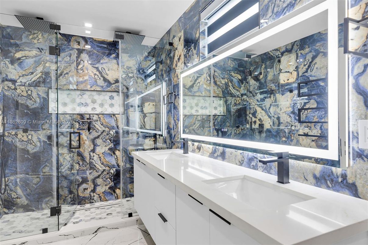 Bathroom, Dual Sink Vanities, Glass Shower, Interior, Marble, Marble Walls, Recessed Lighting