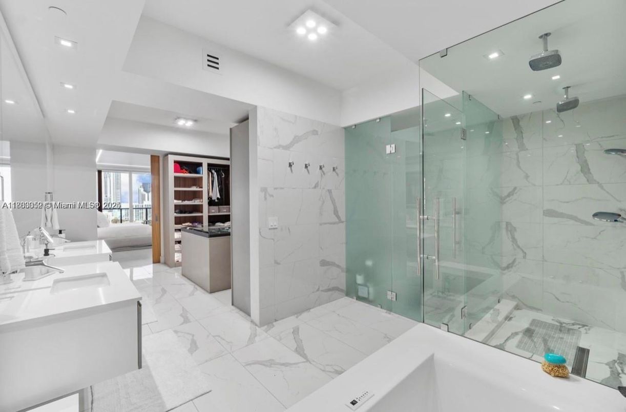 Bathroom, Dual Sink Vanities, Glass Shower, Interior, Marble, Marble Walls, Recessed Lighting
