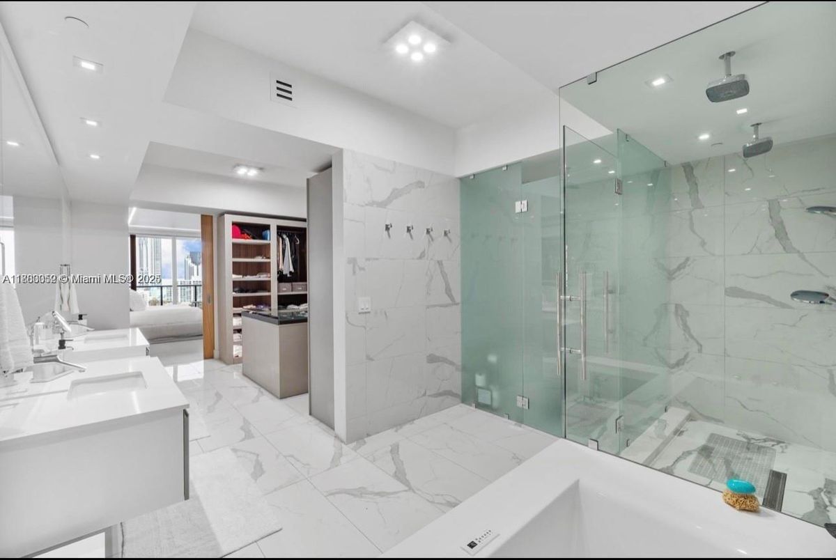 Bathroom, Dual Sink Vanities, Glass Shower, Interior, Marble, Marble Walls, Recessed Lighting