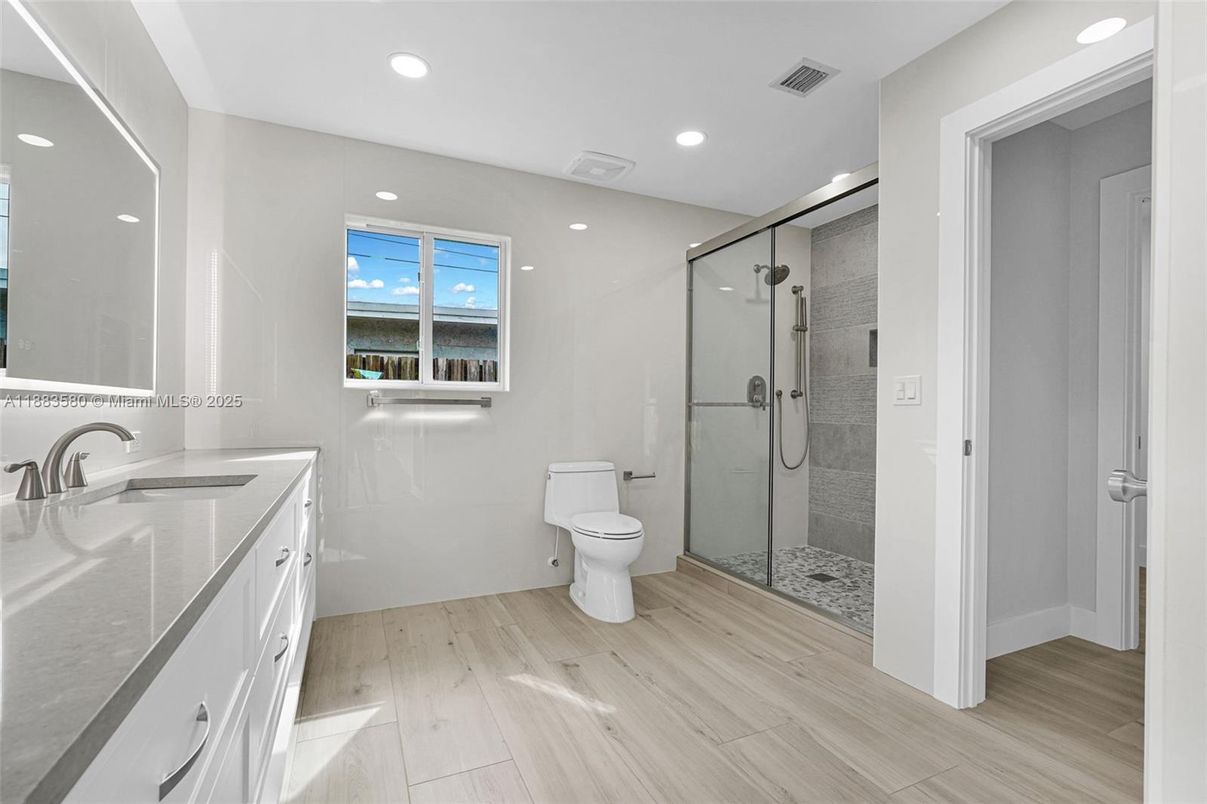 Bathroom, Glass Shower, Interior, Recessed Lighting, Water, Wood Texture Flooring