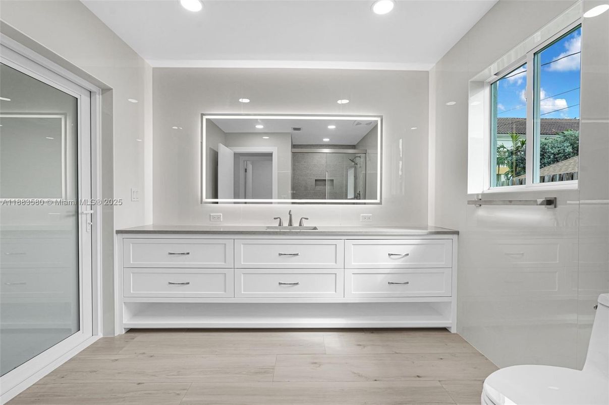 Bathroom, Dual Sink Vanities, Interior, Recessed Lighting, Wood Texture Flooring