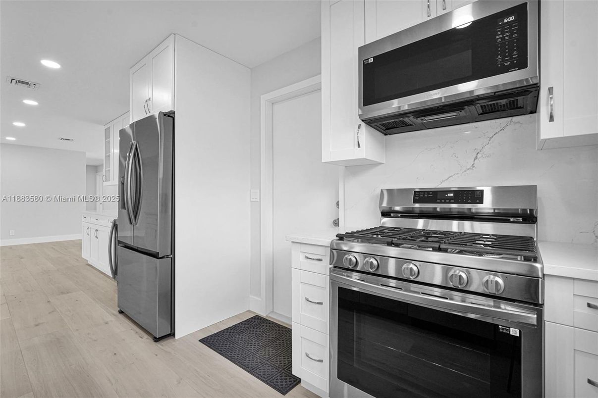 Interior, Kitchen, Recessed Lighting, Stainless Steel Appliances, Wood Texture Flooring