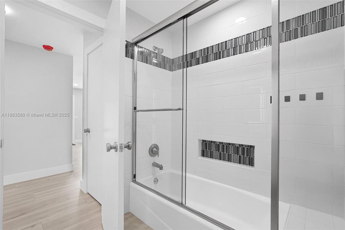 Bathroom, Fireplace, Glass Shower, Interior, Recessed Lighting, Wood Texture Flooring