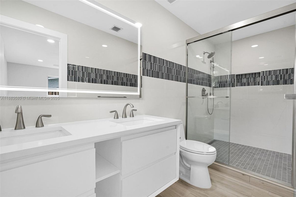 Bathroom, Dual Sink Vanities, Glass Shower, Interior, Recessed Lighting, Wood Texture Flooring