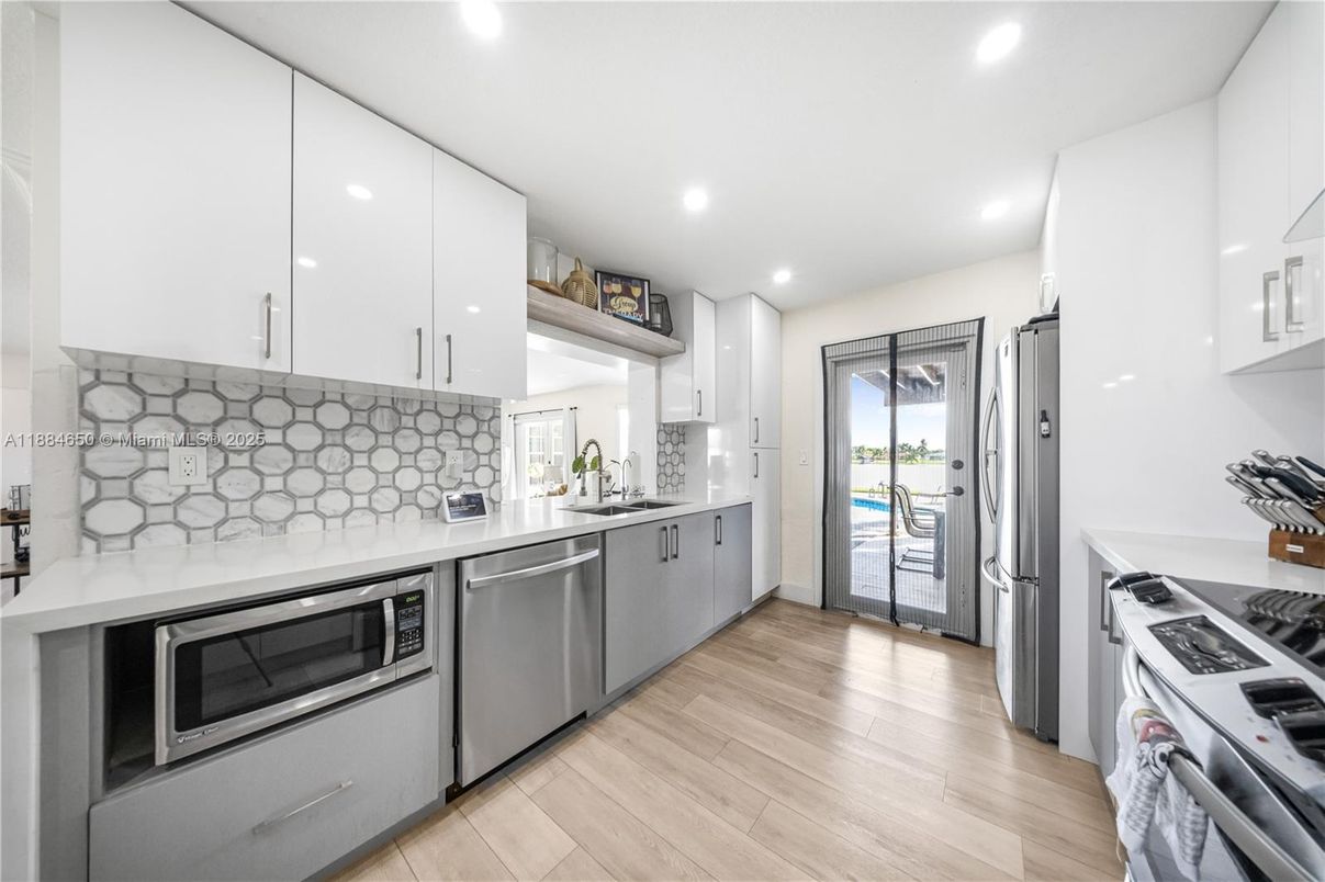 Interior, Kitchen, Recessed Lighting, Stainless Steel Appliances, Wood Texture Flooring