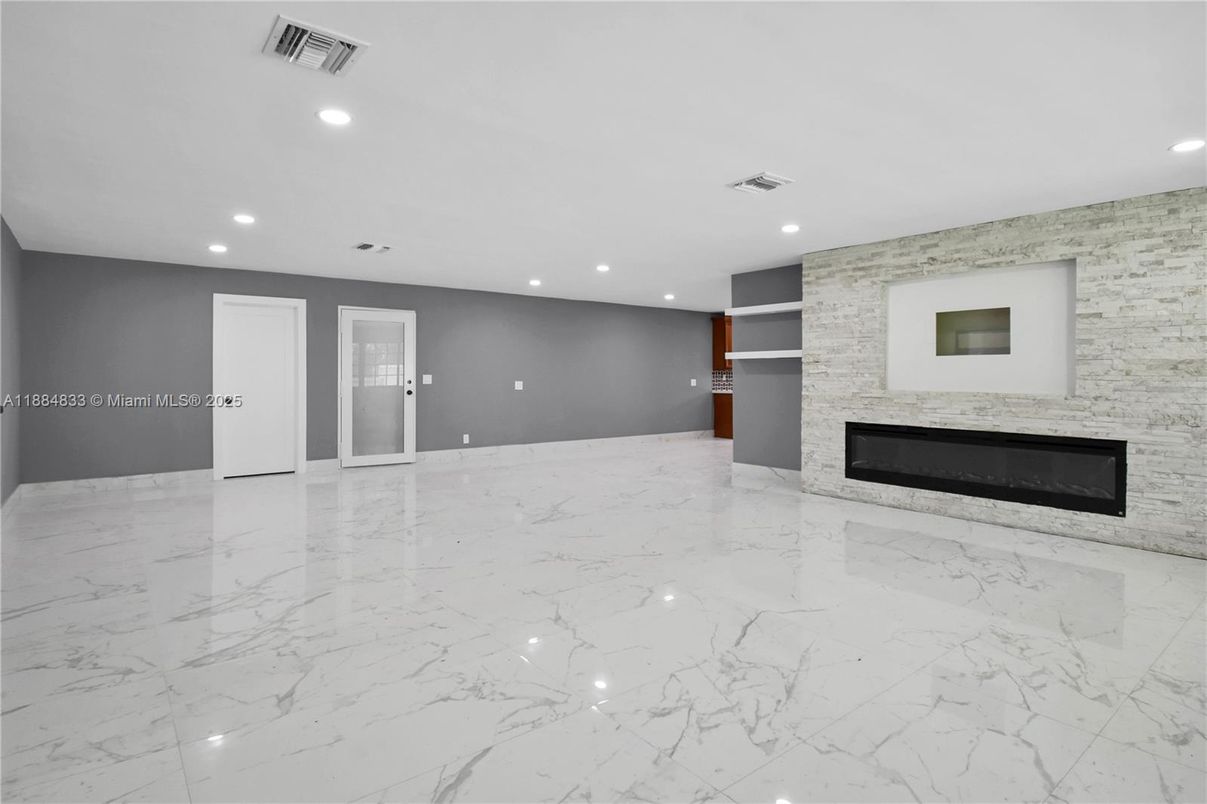 Empty room, Fireplace, Interior, Marble, Recessed Lighting, Stone Walls