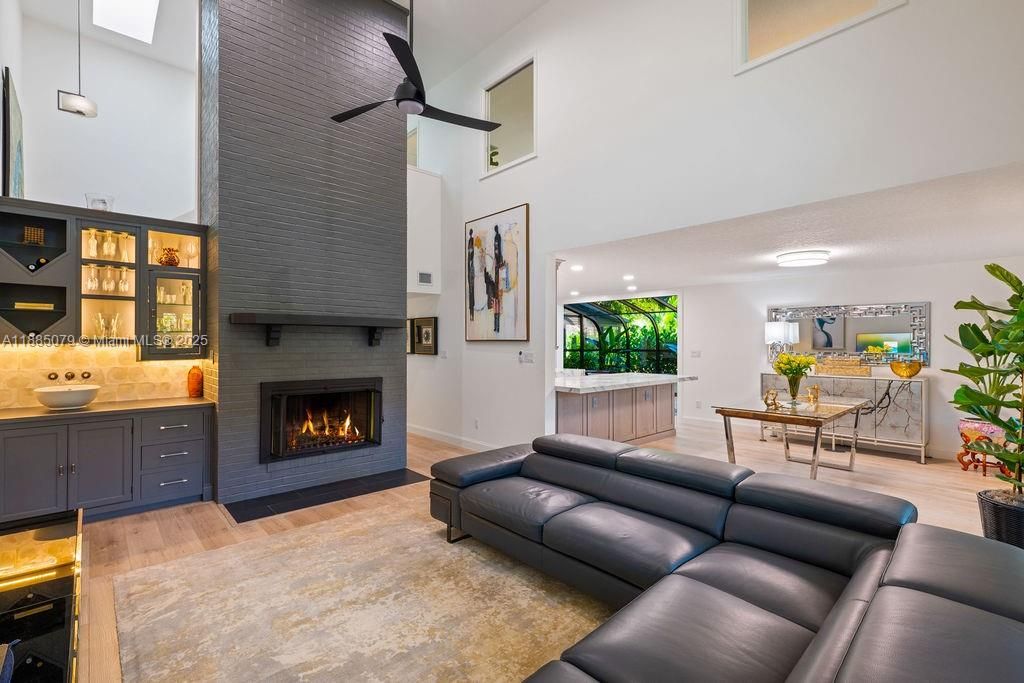 Dining room, Fireplace, Interior, Living room, Pendant Lights, Recessed Lighting, Wood Texture Flooring