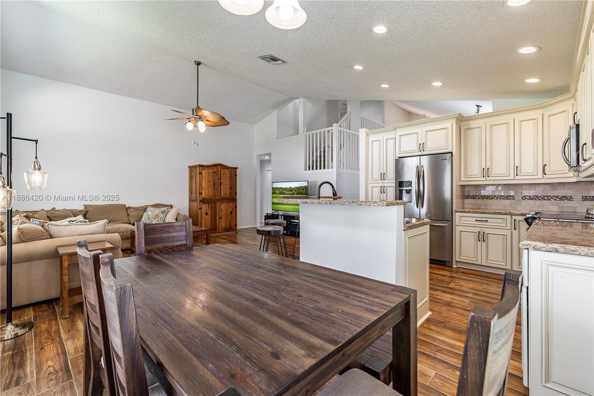 Dining room, Interior, Kitchen, Living room, Pendant Lights, Recessed Lighting, Stainless Steel Appliances, Wood Texture Flooring