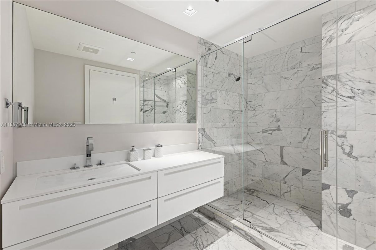 Bathroom, Dual Sink Vanities, Glass Shower, Interior, Marble, Marble Walls, Recessed Lighting