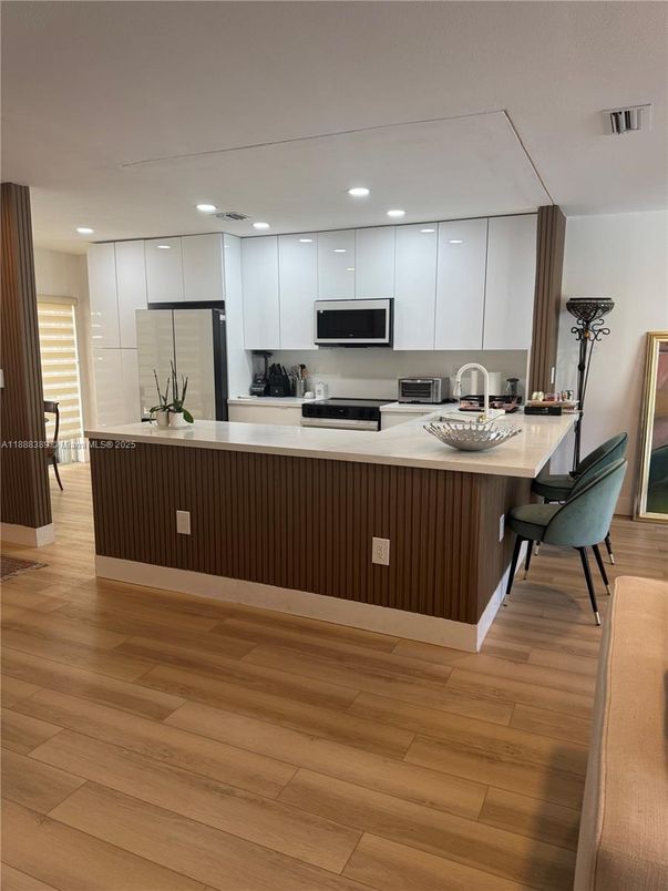 Interior, Kitchen, Recessed Lighting, Stainless Steel Appliances, Wood Texture Flooring