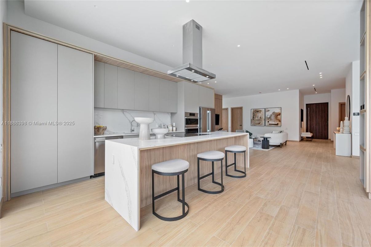 Interior, Kitchen, Marble Walls, Recessed Lighting, Stainless Steel Appliances, Wood Texture Flooring