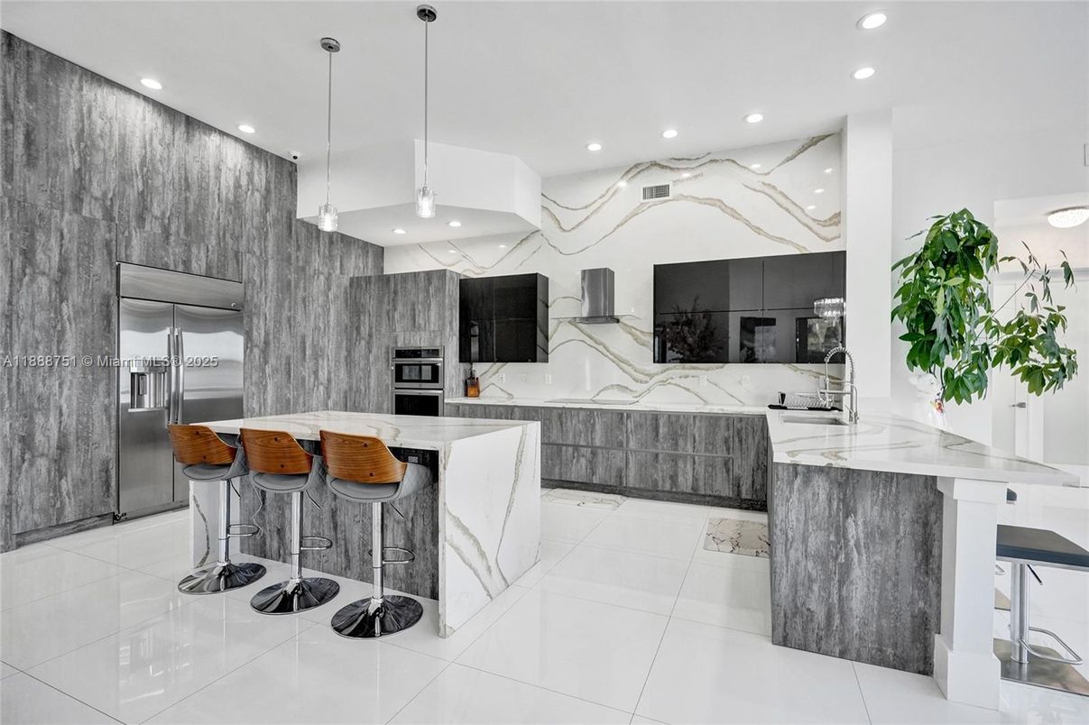 Interior, Kitchen, Marble Walls, Pendant Lights, Recessed Lighting, Stainless Steel Appliances