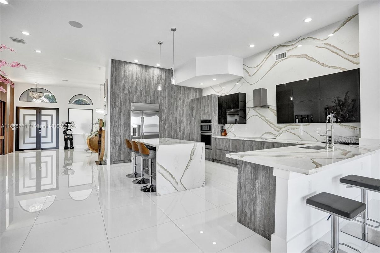 Interior, Kitchen, Marble Walls, Pendant Lights, Recessed Lighting, Stainless Steel Appliances