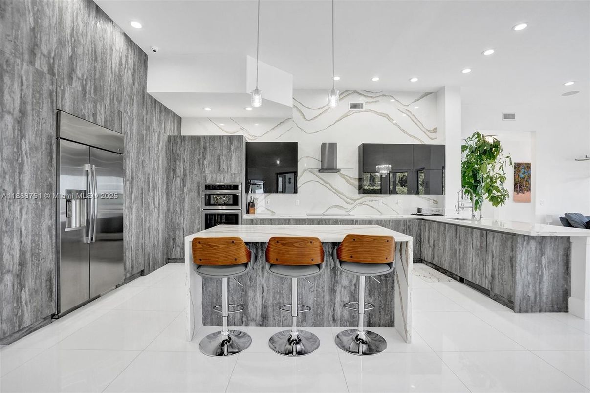 Interior, Kitchen, Marble Walls, Pendant Lights, Recessed Lighting, Stainless Steel Appliances