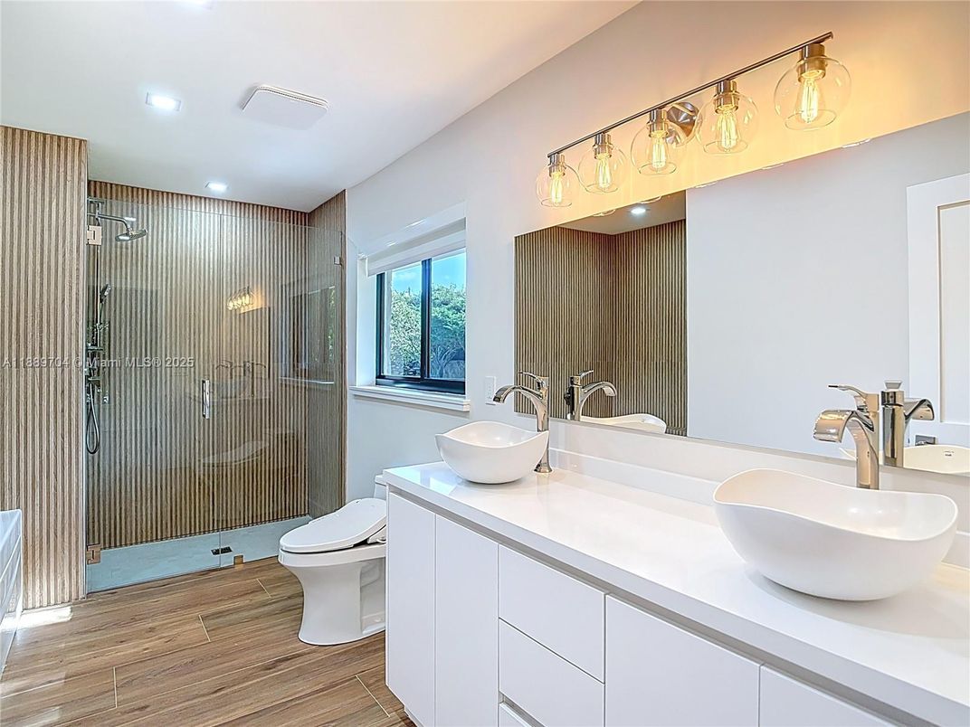 Bathroom, Dual Sink Vanities, Glass Shower, Interior, Recessed Lighting, Wood Texture Flooring