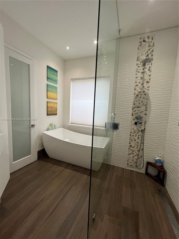 Bathroom, Free Standing Baths, Glass Shower, Interior, Recessed Lighting, Wood Texture Flooring