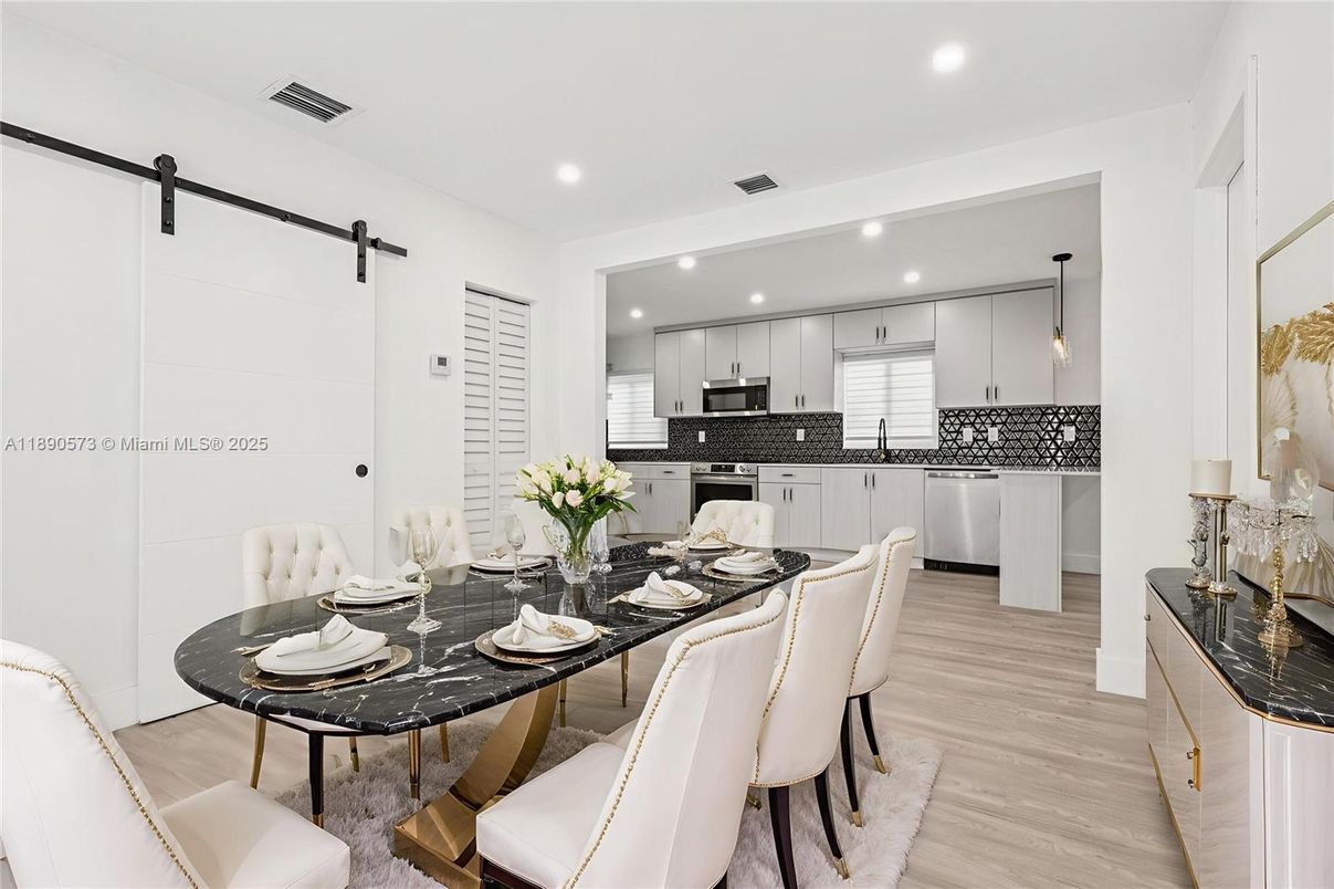 Dining room, Interior, Kitchen, Pendant Lights, Recessed Lighting, Stainless Steel Appliances, Wood Texture Flooring
