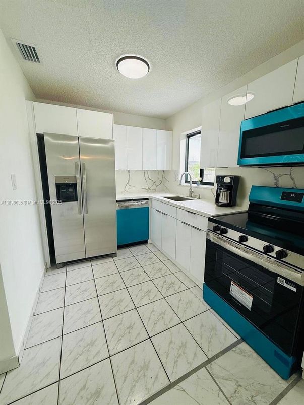 Interior, Kitchen, Marble, Marble Walls, Recessed Lighting, Stainless Steel Appliances