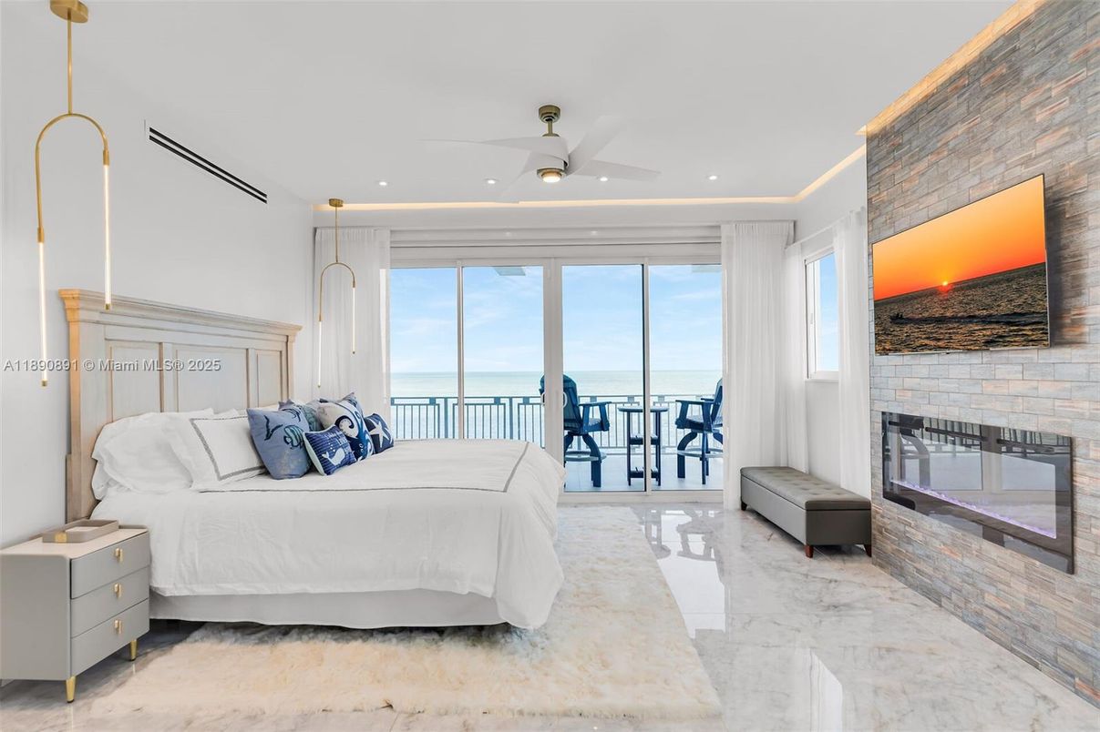 Bedroom, Fireplace, Interior, Marble, Pendant Lights, Recessed Lighting, Stone Walls, Water