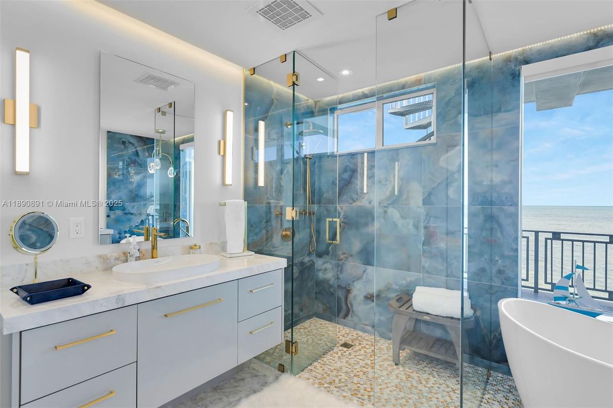 Bathroom, Dual Sink Vanities, Free Standing Baths, Glass Shower, Interior, Marble Walls, Recessed Lighting, Water