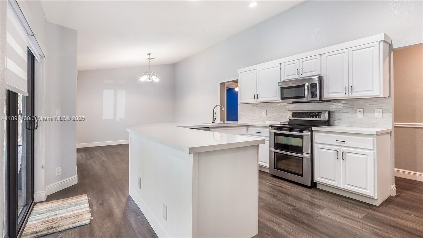 Chandelier, Interior, Kitchen, Recessed Lighting, Stainless Steel Appliances, Wood Texture Flooring