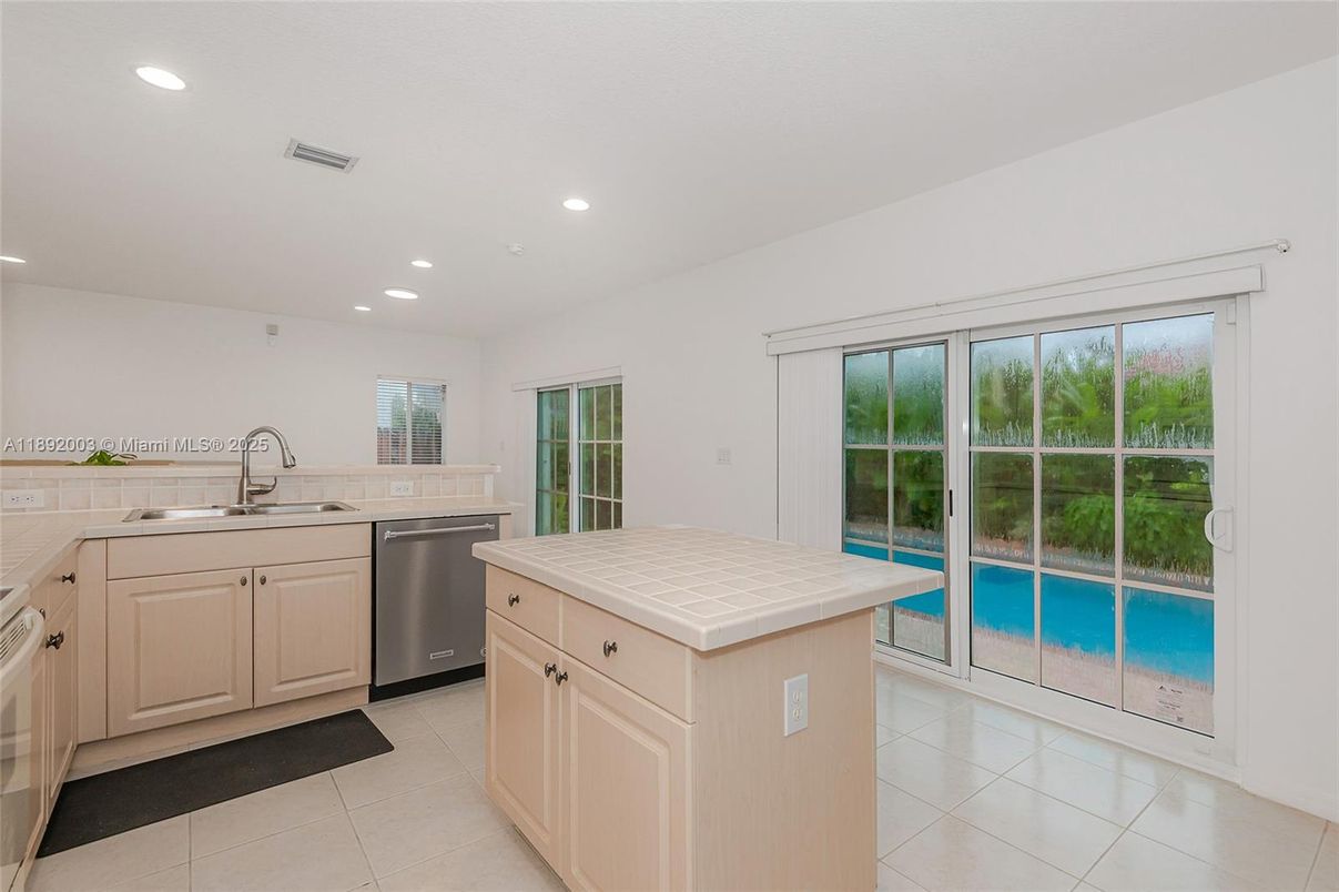 Interior, Kitchen, Recessed Lighting, Stainless Steel Appliances, Tile Countertops