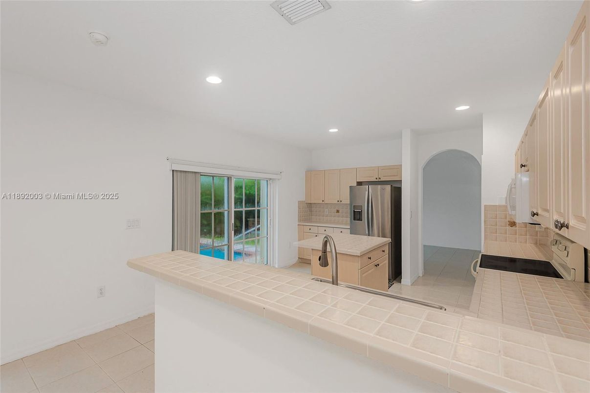 Interior, Kitchen, Recessed Lighting, Stainless Steel Appliances, Tile Countertops