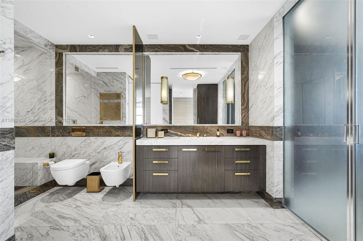 Bathroom, Dual Sink Vanities, Glass Shower, Interior, Marble, Marble Walls, Recessed Lighting