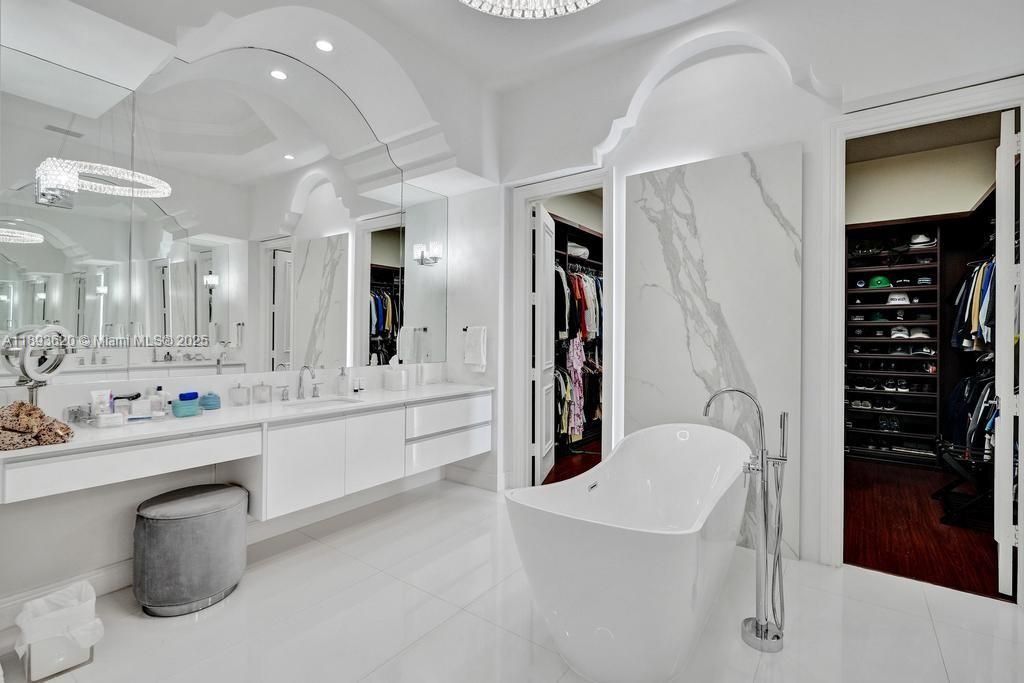 Bathroom, Dual Sink Vanities, Free Standing Baths, Interior, Marble, Marble Walls, Recessed Lighting, Wood Texture Flooring