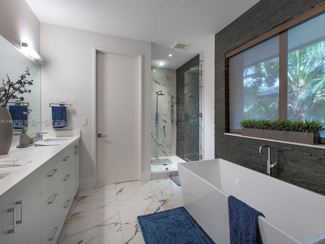 Bathroom, Dual Sink Vanities, Glass Shower, Interior, Marble, Marble Walls, Recessed Lighting