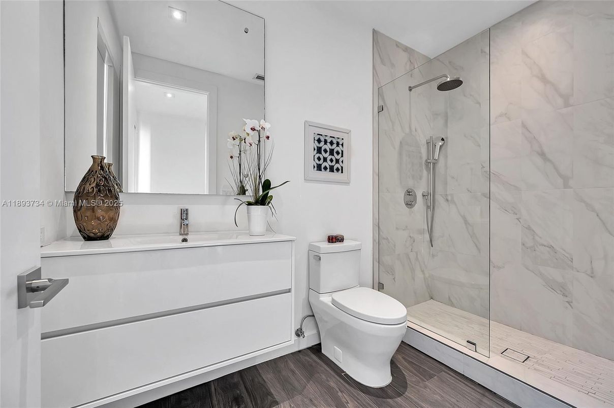 Bathroom, Glass Shower, Interior, Marble Walls, Recessed Lighting, Wood Texture Flooring