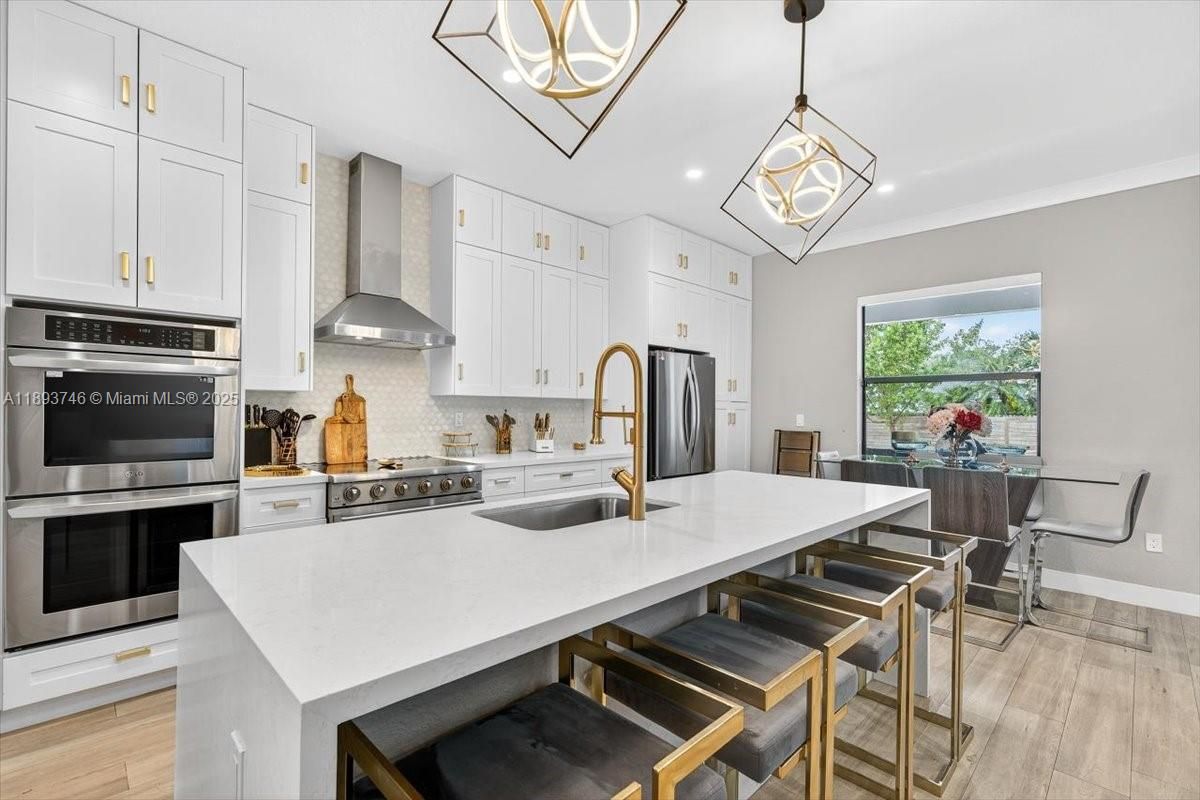 Dining room, Interior, Kitchen, Pendant Lights, Recessed Lighting, Stainless Steel Appliances, Wood Texture Flooring
