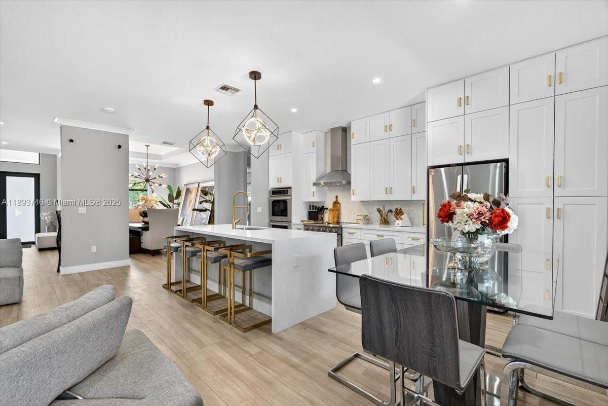 Dining room, Interior, Kitchen, Pendant Lights, Recessed Lighting, Stainless Steel Appliances, Wood Texture Flooring