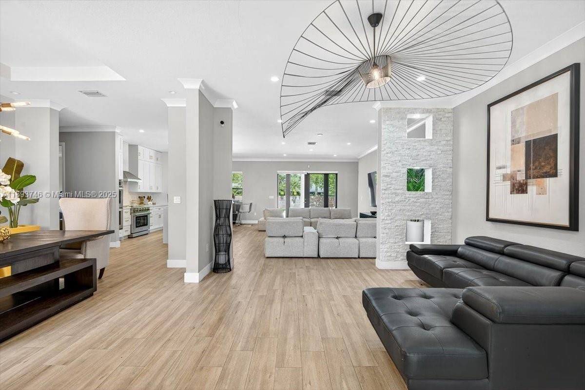 Dining room, Interior, Kitchen, Living room, Pendant Lights, Recessed Lighting, Stainless Steel Appliances, Wood Texture Flooring