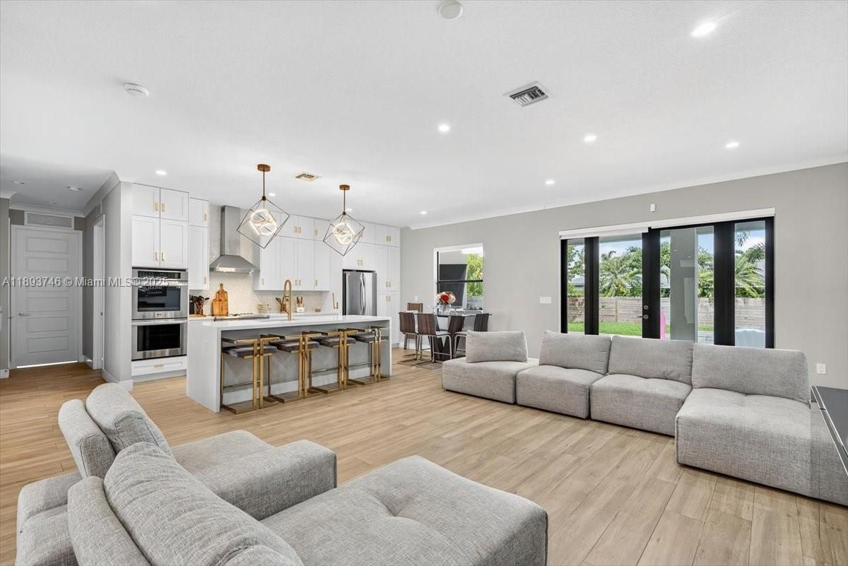 Dining room, Interior, Kitchen, Living room, Pendant Lights, Recessed Lighting, Stainless Steel Appliances, Wood Texture Flooring