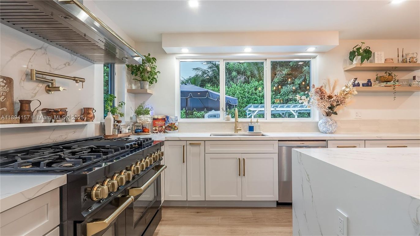 Interior, Kitchen, Marble Walls, Recessed Lighting, Stainless Steel Appliances, Wood Texture Flooring