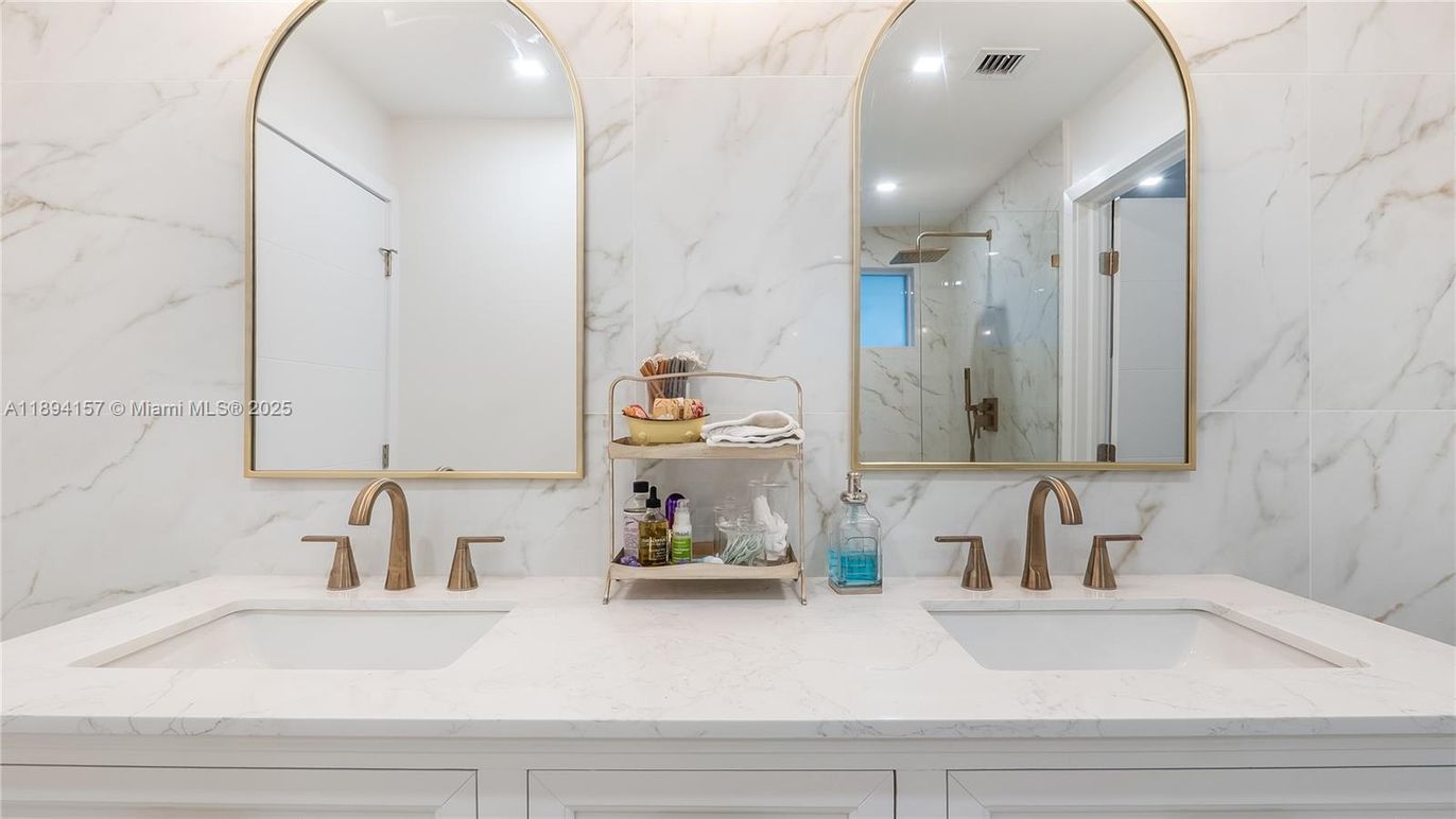 Bathroom, Dual Sink Vanities, Glass Shower, Interior, Marble Walls, Recessed Lighting