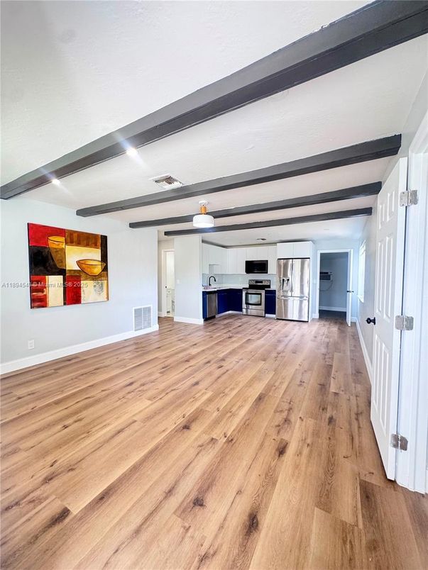 Empty room, Interior, Kitchen, Stainless Steel Appliances, Wood Texture Flooring
