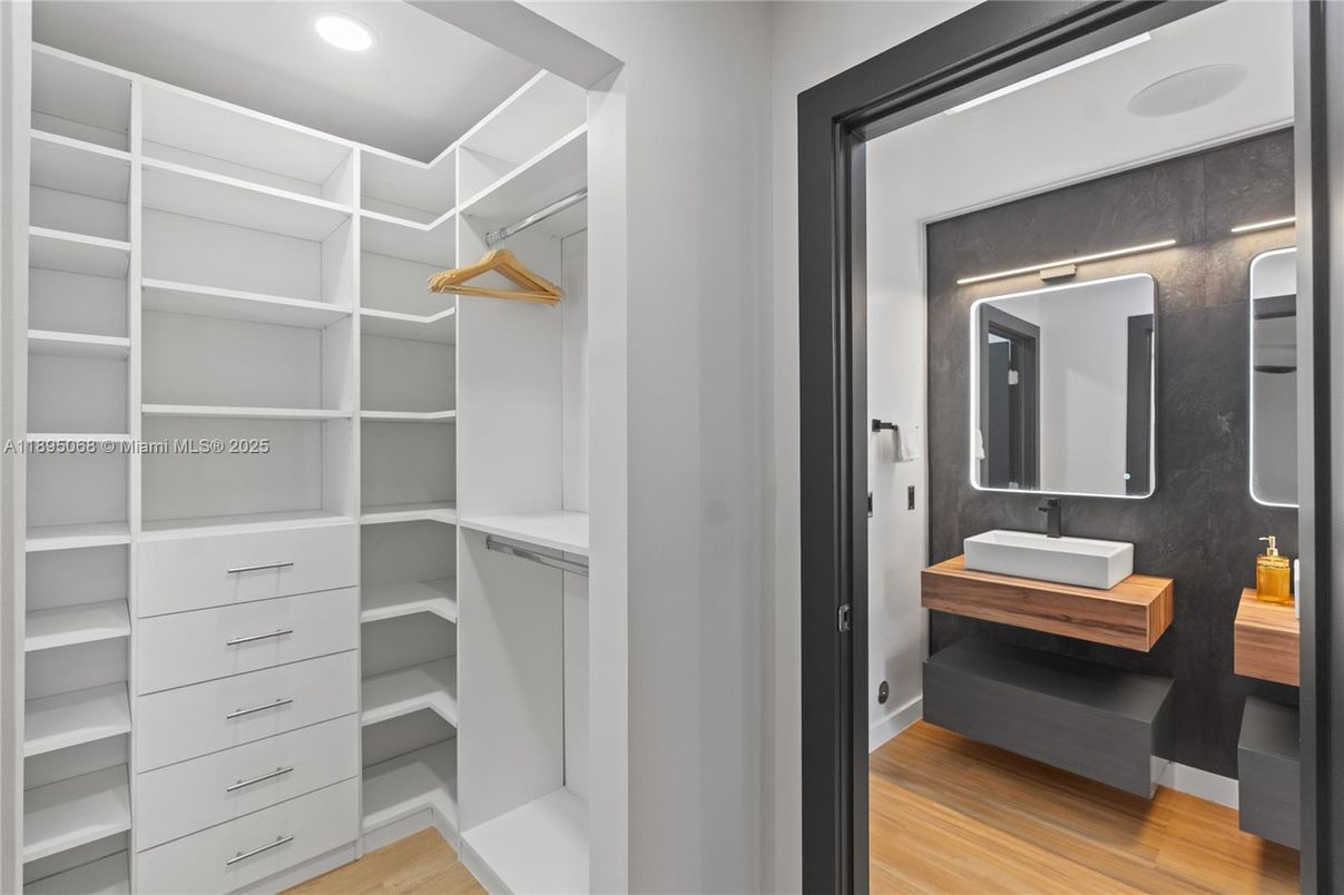 Bathroom, Dual Sink Vanities, Interior, Recessed Lighting, Walk-in Closets, Wood Texture Flooring