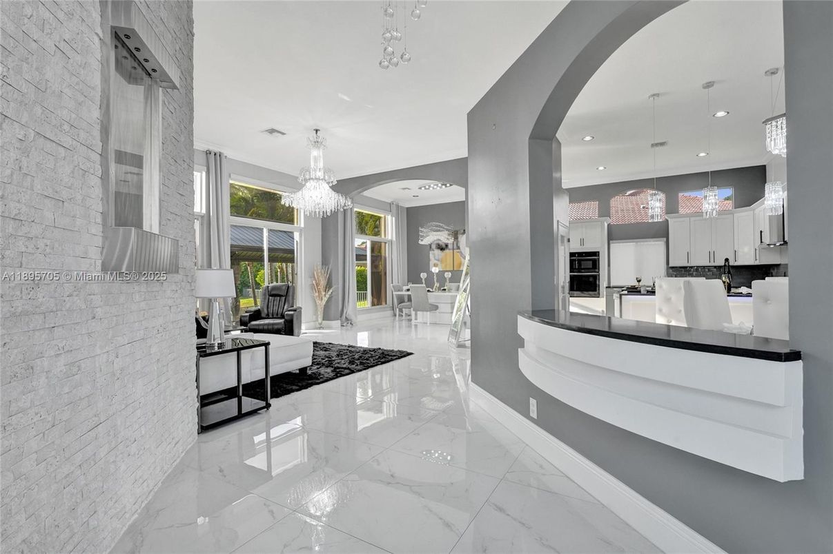 Chandelier, Interior, Kitchen, Marble, Pendant Lights, Recessed Lighting, Stainless Steel Appliances, Stone Walls