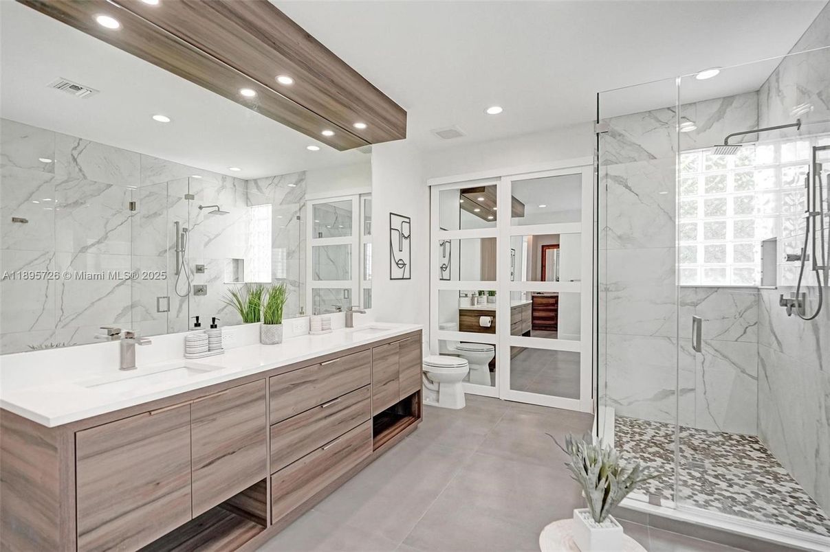 Bathroom, Dual Sink Vanities, Glass Shower, Interior, Marble Walls, Recessed Lighting