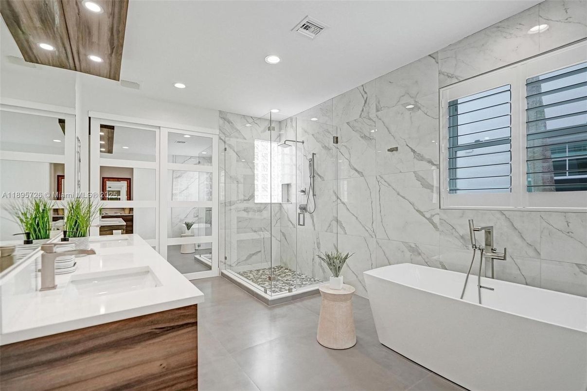 Bathroom, Dual Sink Vanities, Free Standing Baths, Glass Shower, Interior, Marble Walls, Recessed Lighting