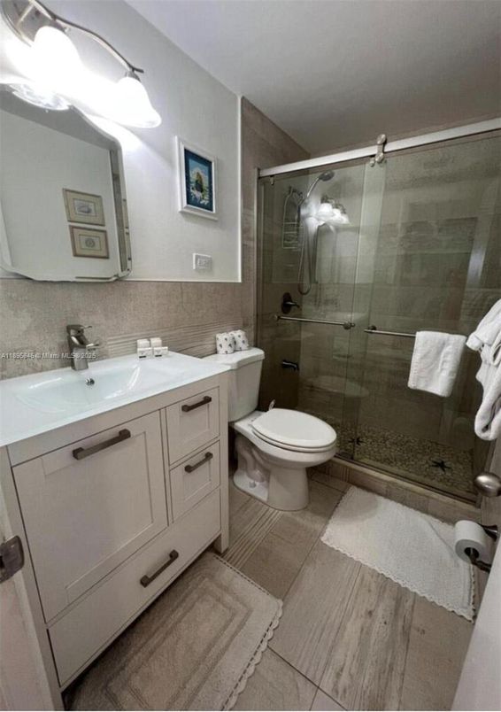 Bathroom, Dual Sink Vanities, Glass Shower, Interior, Wood Texture Flooring