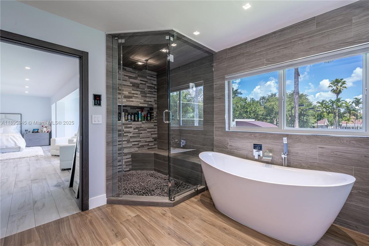 Bathroom, Free Standing Baths, Glass Shower, Interior, Recessed Lighting, Wood Texture Flooring