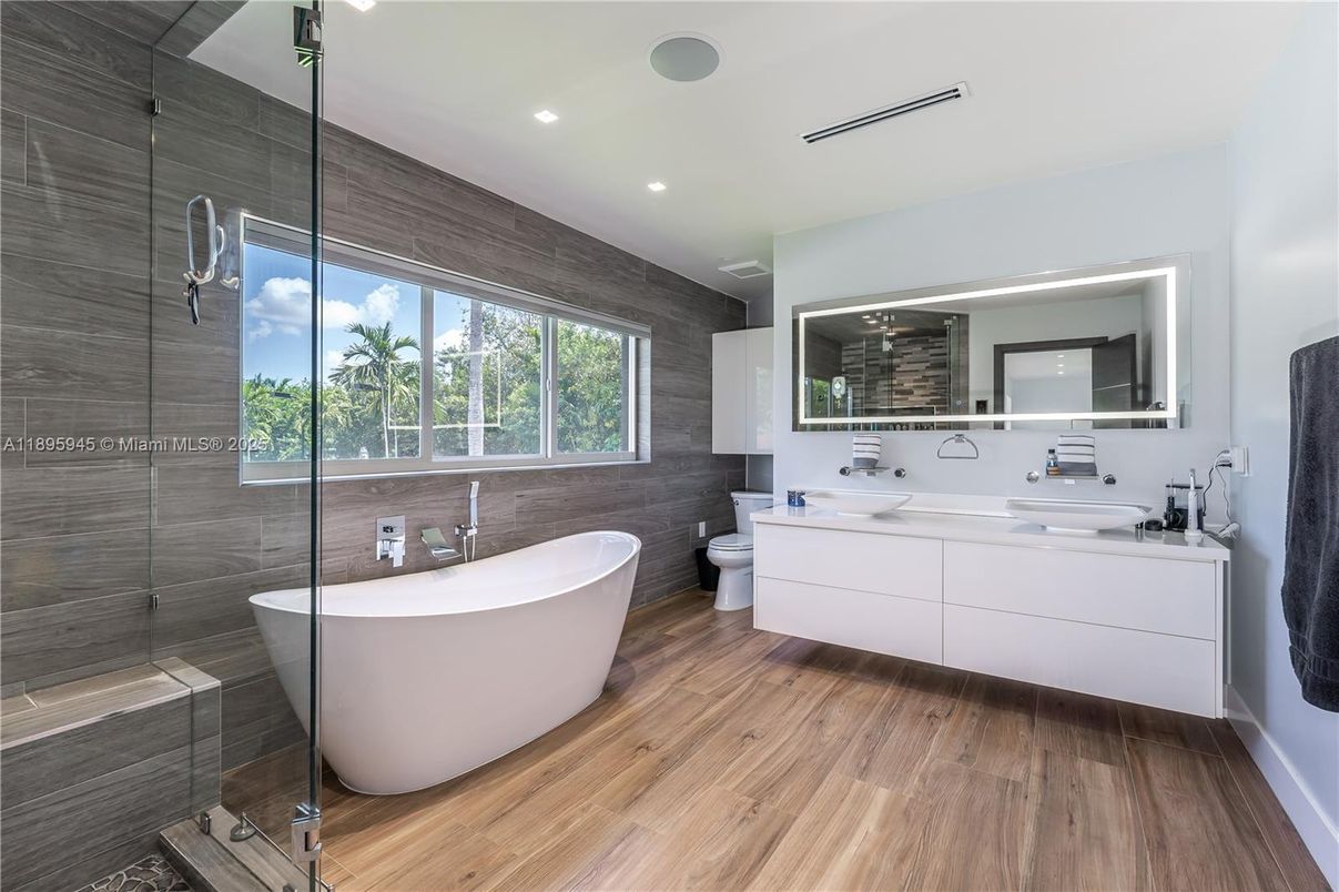 Bathroom, Dual Sink Vanities, Free Standing Baths, Glass Shower, Interior, Recessed Lighting, Wood Texture Flooring