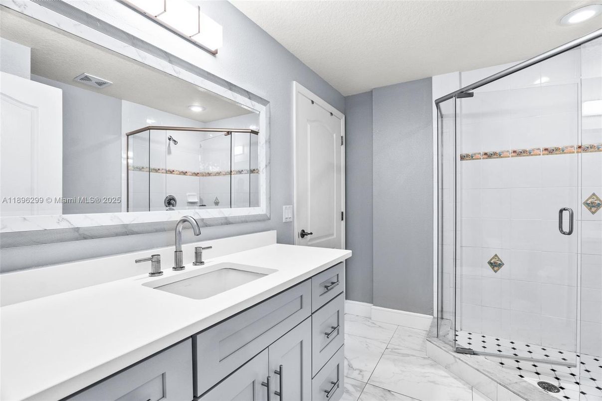 Bathroom, Dual Sink Vanities, Glass Shower, Interior, Marble, Recessed Lighting